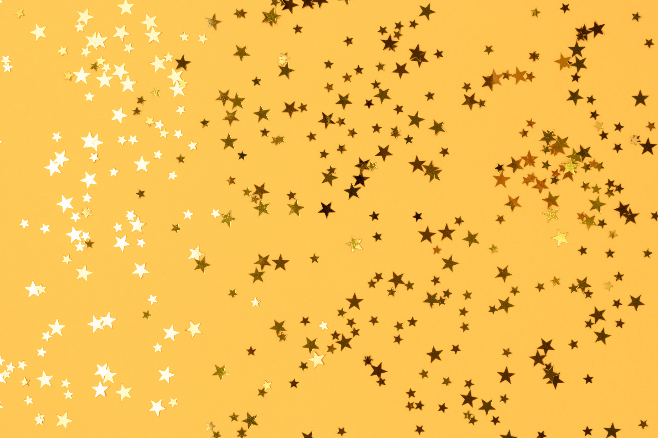 Gold Stars Confetti on Yellow Background