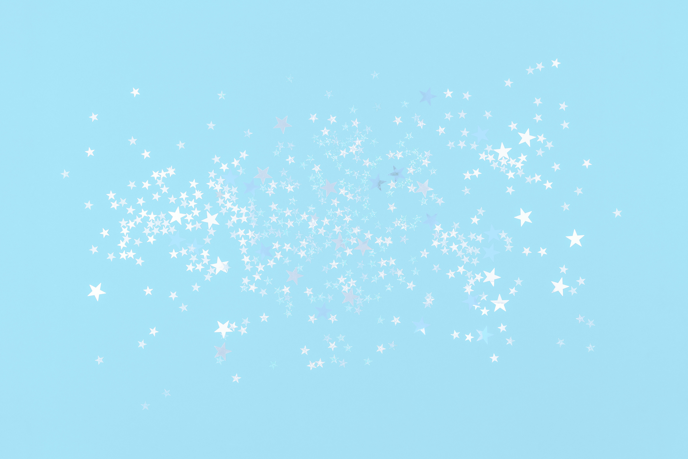 White and light blue holographic star glitter confetti background